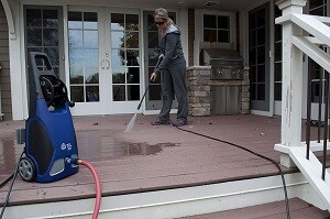 Using AR Blue Clean pressure washer to clean deck