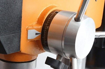 Depth setting on drill press for wood drilling